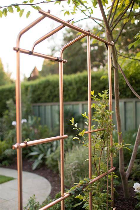 Copper trellis in a garden with climbers